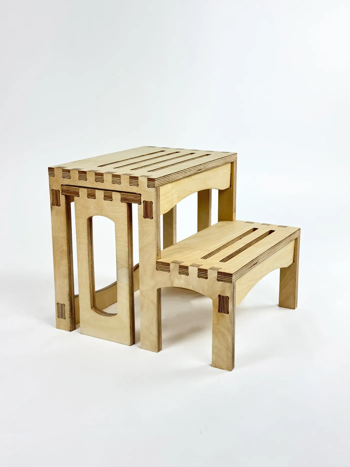 The finished Latus step stool in plywood, showing its slatted top step and finger-jointed frame.